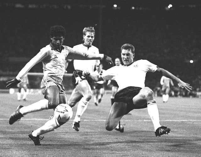 England defender Terry Butcher (right) tries to block a Brazil attack