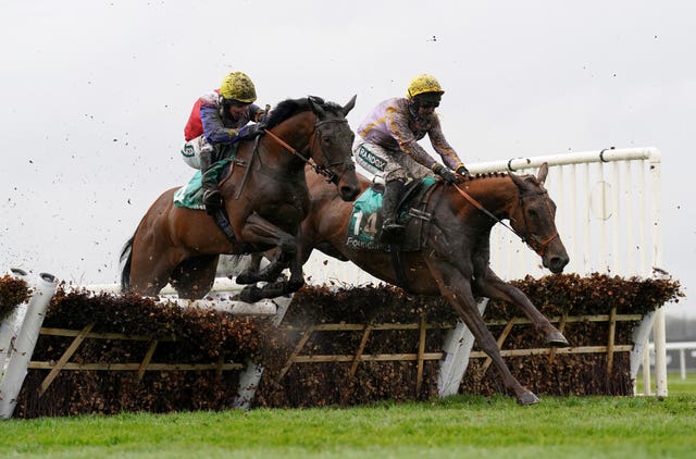 Hansard and Jamie Moore (left) in action at Aintree 
