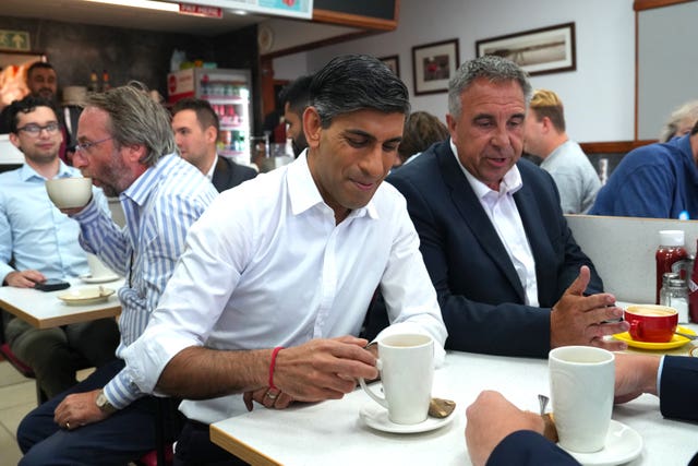 Prime Minister Rishi Sunak with newly elected Conservative MP Steve Tuckwell at the Rumbling Tum cafe in Uxbridge, west London