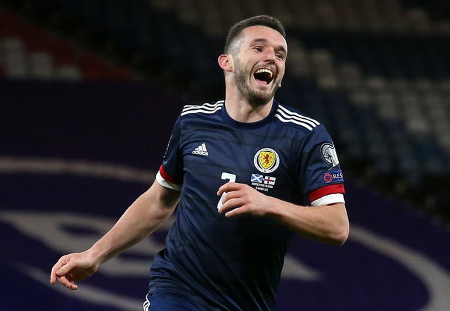 John McGinn celebrates scoring his second goal against the Faroe Islands