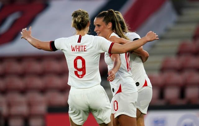 Ella Toone, centre, and England celebrate their opening goal against North Macedonia in September 2021
