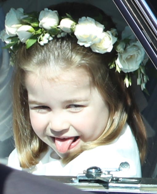 A bridesmaid, thought to be Princess Charlotte sticks out her tongue (Andrew Milligan/PA)