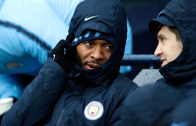 Raheem Sterling, left, and John Stones on the Manchester City bench