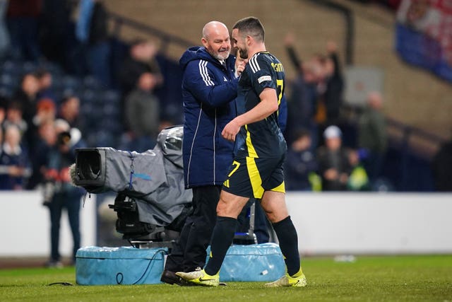 Scotland manager Steve Clarke, left, congratulates match-winner John McGinn