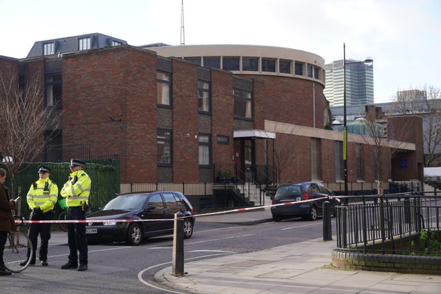 Police at the scene of a shooting outside a memorial service which was being held in St Aloysius Roman Catholic Church on Phoenix Road, in Euston on Saturday