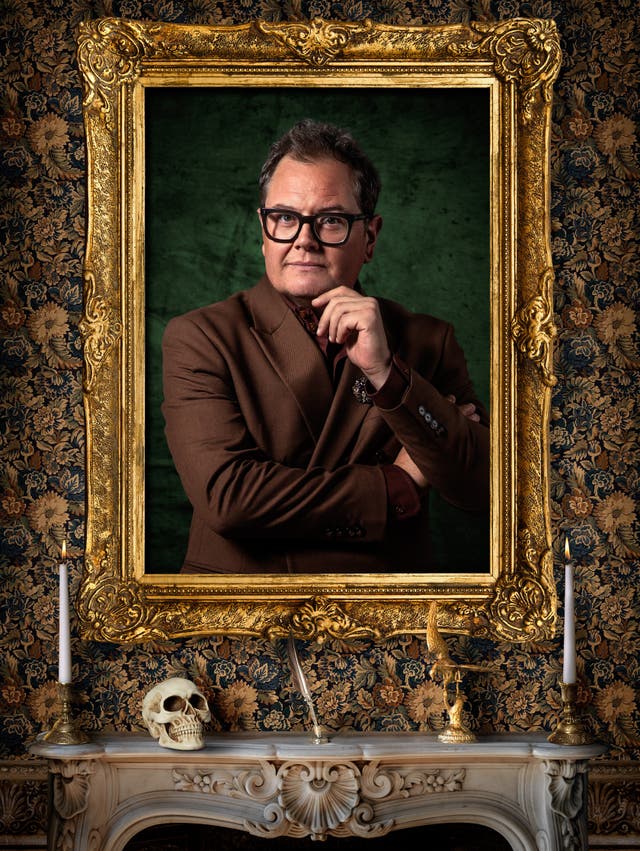 Alan Carr looks thoughtful in a publicity shot for The Celebrity Traitors