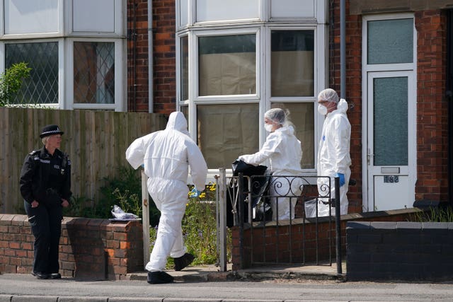 Police officers at the scene in High Holme Road, Louth, Lincolnshire, (Joe Giddens/PA)