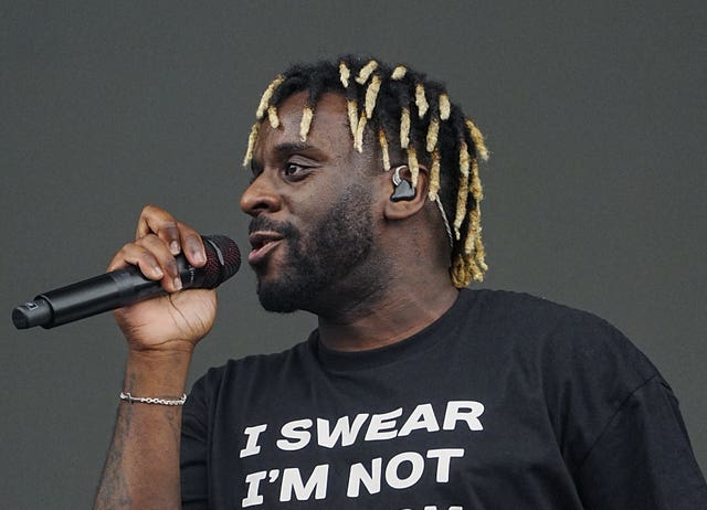 Side view of Myles Smith performing