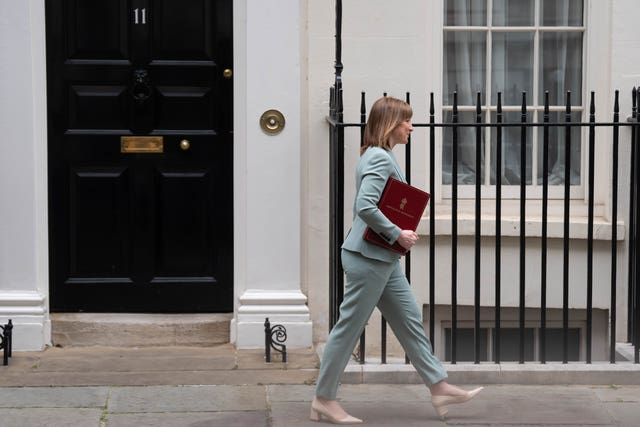 Rachel Reeves walking on Downing Street, with the door to Number 11 behind her