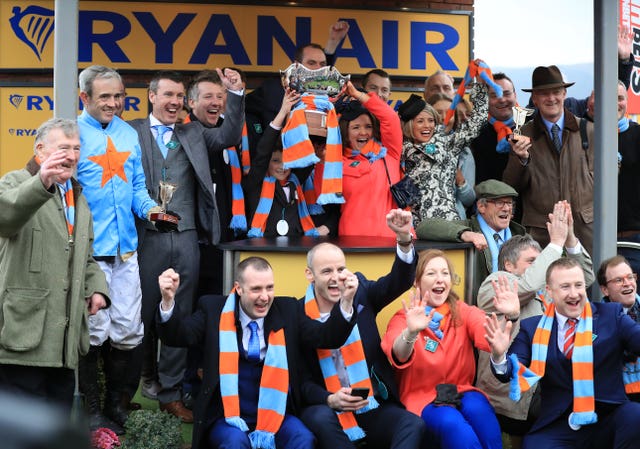 Colm O'Connell (left of trophy) and his family celebrate after winning the 2017 Ryanair 