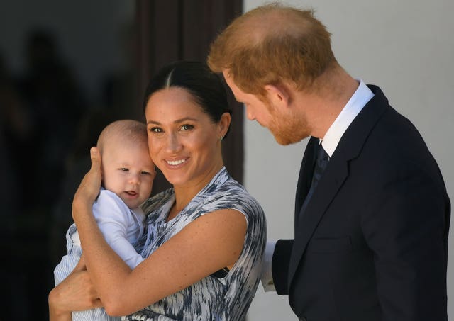 The Duchess of Sussex with her son Archie and husband Harry