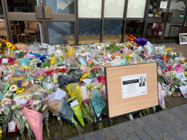 A sign placed next to the floral tributes left outside the Belfairs Methodist Church in Leigh-on-Sea, Essex (Sam Russell/PA)