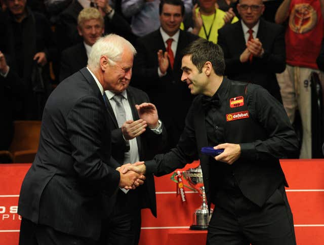Ronnie O’Sullivan shakes hands with World Snooker chairman Barry Hearn 