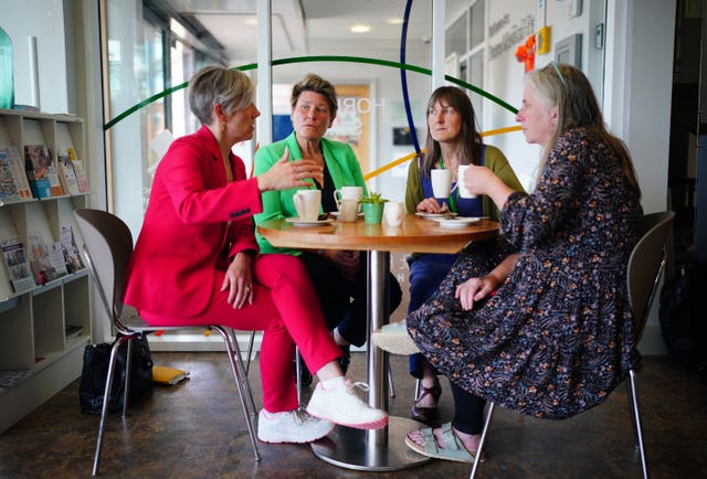 Lib Dem deputy leader Daisy Cooper and by-election candidate Sarah Dyke speak with staff from the Frome Medical Centre