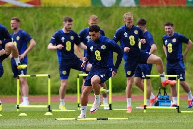 The Scotland squad jump over hurdles during training 
