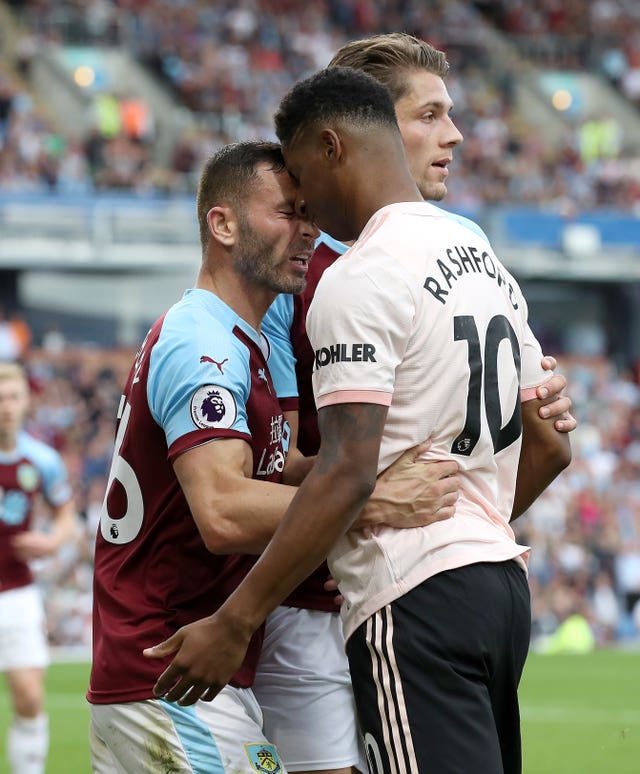 Phil Bardsley, left, clashes with Marcus Rashford