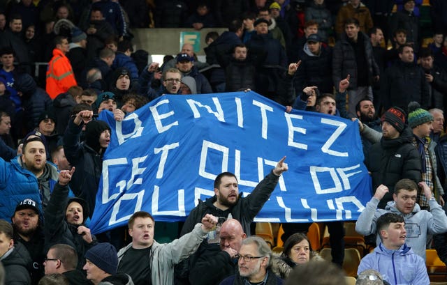 Everton fans hold a protest banner against Everton manager Rafael Benitez during the Premier League match at Carrow Road. 