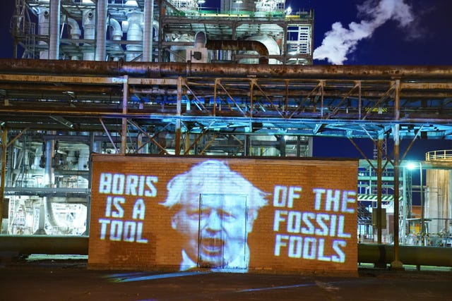 A projection at the Grangemouth Oil Refinery in Falkirk, by climate activists from Ocean Rebellion, during Cop26 