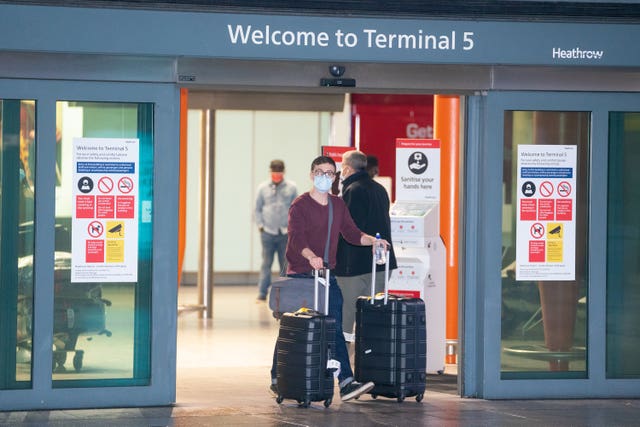 Passengers arrive at London Heathrow’s Terminal 5 