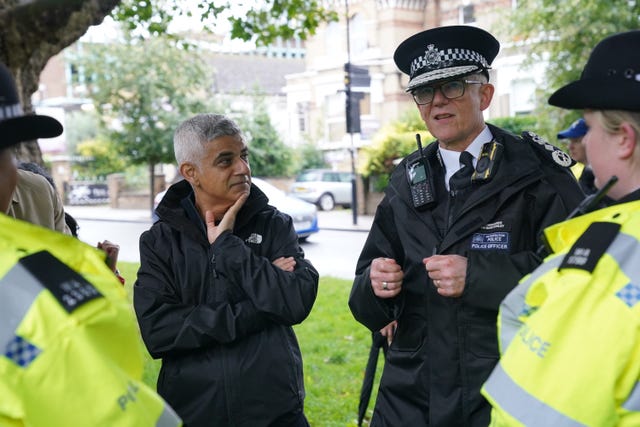 Mayor of London Sadiq Khan and Sir Mark Rowley speak to officers