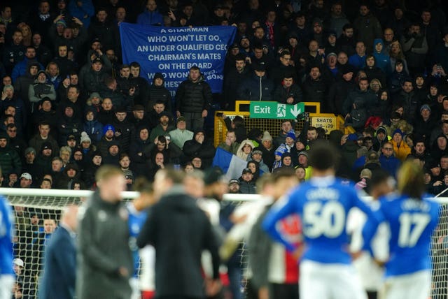 Everton fans hold up a protest banner 