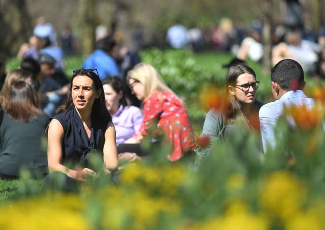 In the city, the best place to bask in the sun was in the park (Victoria Jones/PA )