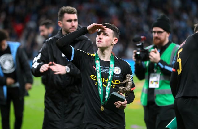 Phil Foden with his man of the match trophy 