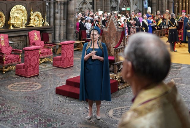 Penny Mordaunt holds the Swords of State at the coronation ceremony
