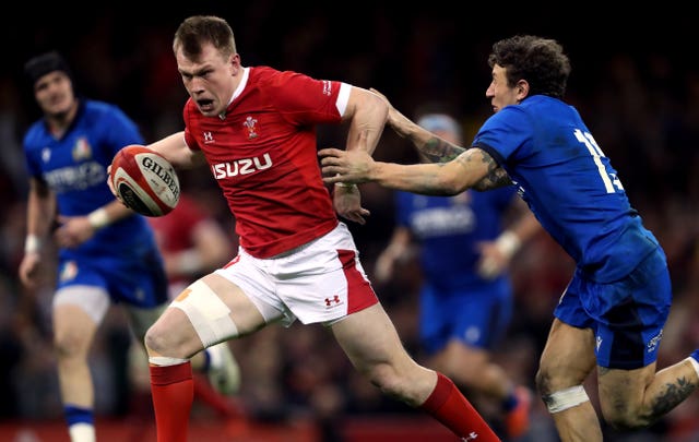 Nick Tompkins, left, bursts clear to score against Italy