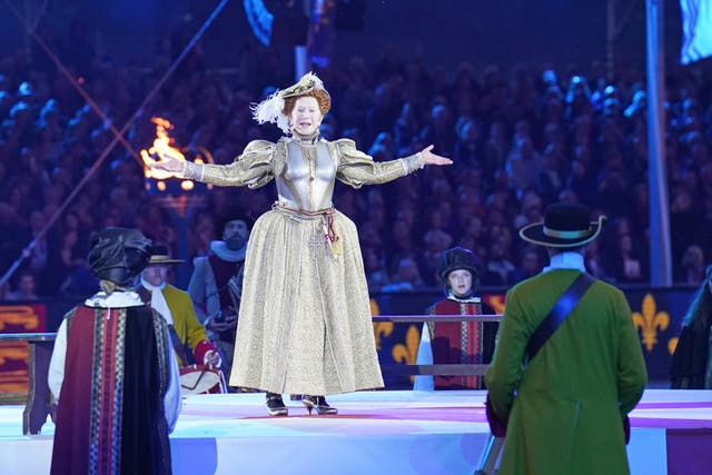 Dame Helen Mirren dressed as Queen Elizabeth I performs 