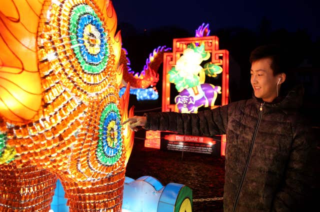A visitor takes in the Giant Lanterns of China (Jane Barlow/PA)