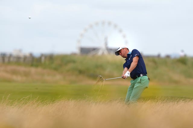 Justin Thomas plays from the first fairway