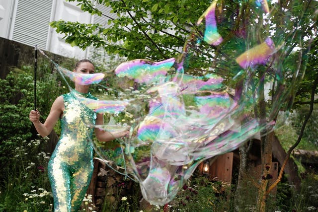 A bubble artist performs