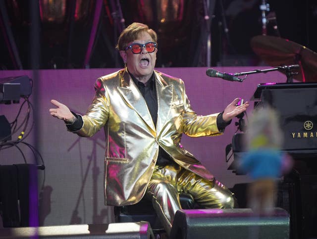 Elton John performing on the Pyramid Stage at the Glastonbury Festival 