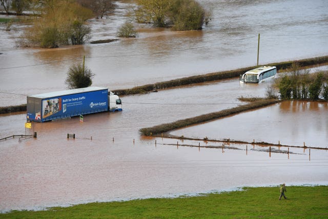 A lorry and a coach submerged in floodwater