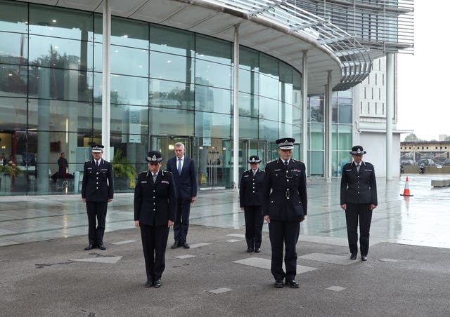 Metropolitan Police Commissioner Dame Cressida Dick (2nd left) and colleagues observe a minute’s silence for police officer Sergeant Matt Ratana at the Empress State Building, London 