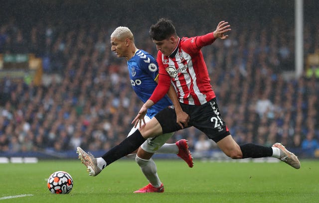 Southampton's Tino Livramento challenges Everton forward Richarlison for the ball