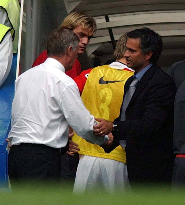 Mourinho, right, shakes hands with Sir Alex Ferguson