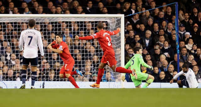 Luis Suarez (second left) scores against Tottenham. (PA)