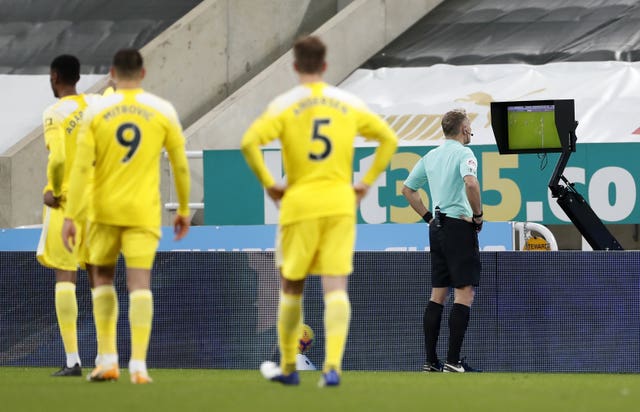 Referee Graham Scott checked the pitchside monitor before awarding a penalty to Newcastle and sending off Fulham''s Joachim Andersen