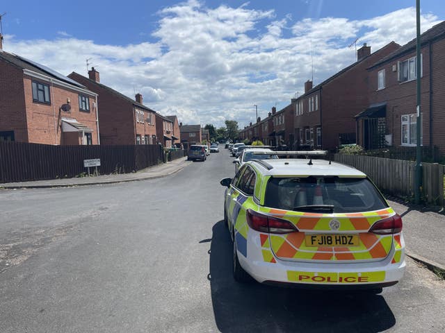 Police cars could be seen in nearby Lauriston Drive on Monday (Callum Parke/PA)