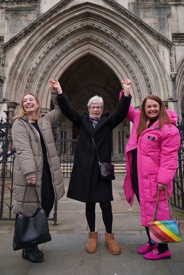 Former subpostmistress Kathleen Crane outside the Royal Courts of Justice in London with her daughters Lucy (left) and Katy