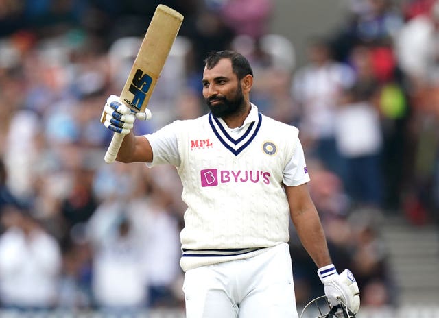 India's Mohammed Shami celebrates his half-century