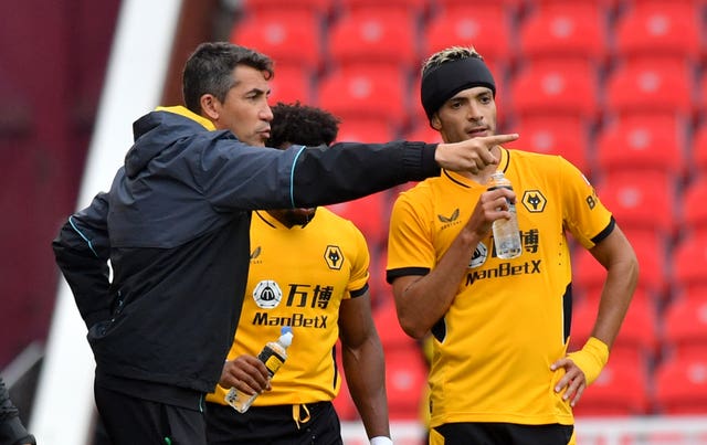 Bruno Lage, left, gives instructions to Raul Jimenez on the sideline