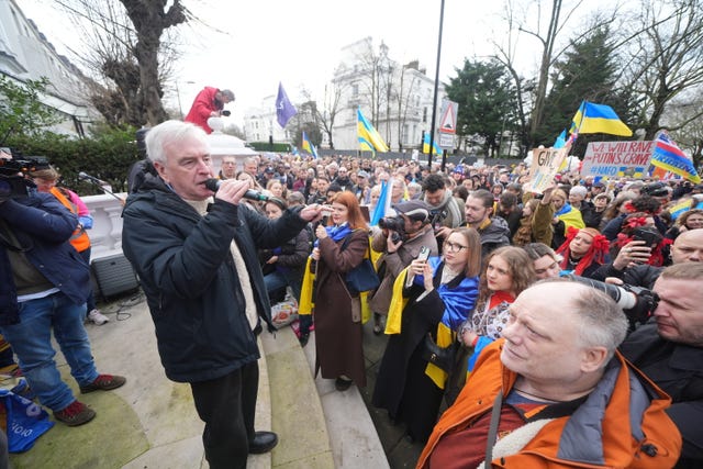 Labour MP John McDonnell addresses people taking part in the march