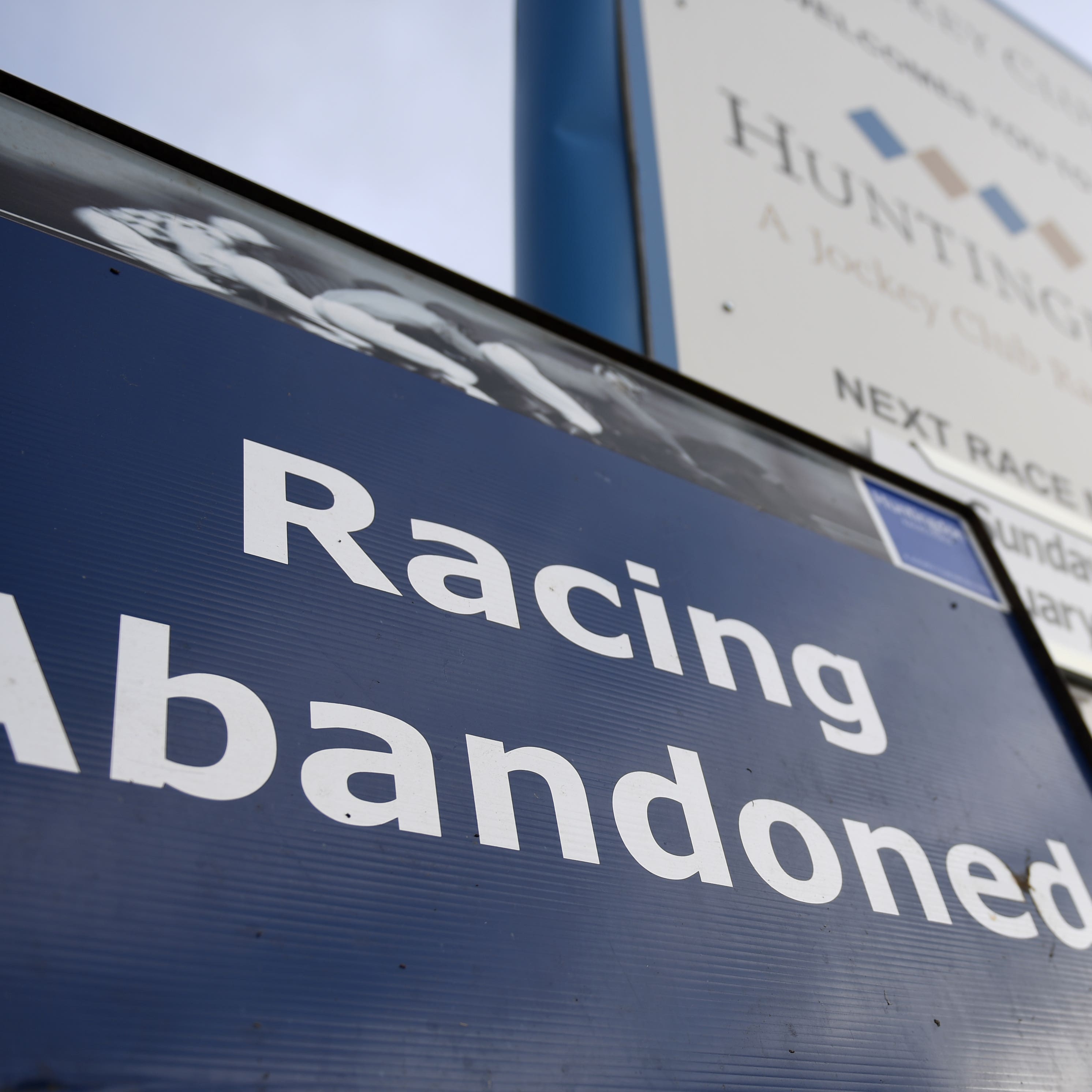A sign at Huntingdon Racecourse provides on-site confirmation that racing is abandoned