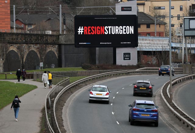 A digital billboard in Glasgow showing the words #ResignSturgeon