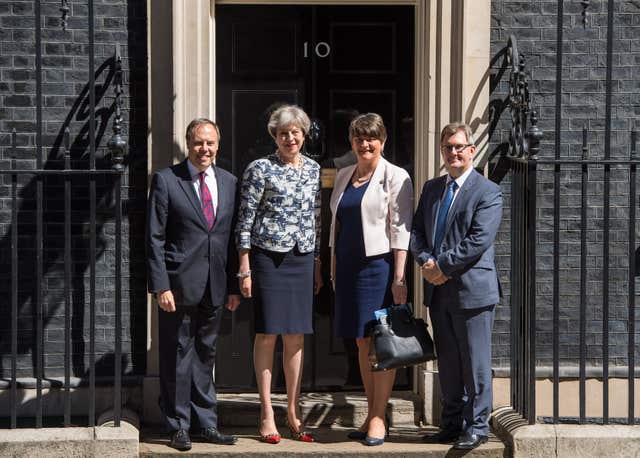 Theresa May with DUP leader Arlene Foster, deputy leader Nigel Dodds and MP Sir Jeffrey Donaldson outside 10 Downing Street ahead of talks aimed at finalising a deal to prop up the minority Conservative Government