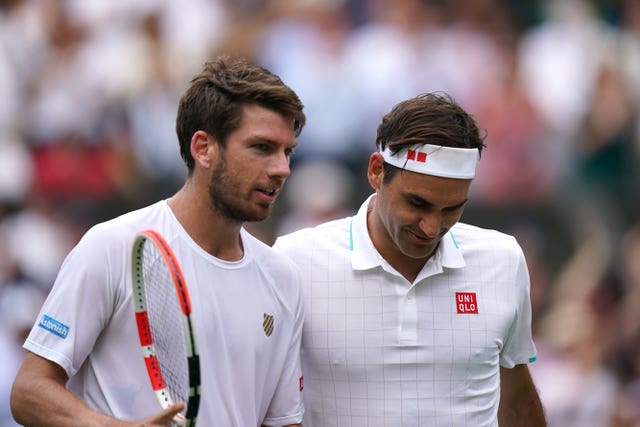 In the men's competition Roger Federer (right) defeated Britain's Cameron Norrie (left) in four sets (Adam Davy/PA).