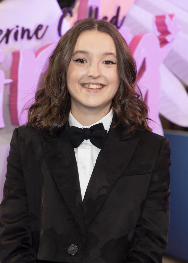 Bella Ramsey smiles at photographers at the Catherine Called Birdy UK premiere in London